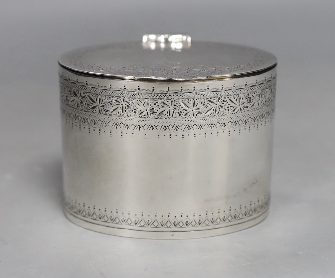 A late Victorian engraved silver oval tea caddy, Edward Hutton, London, 1891, height 74mm, 6.6oz.